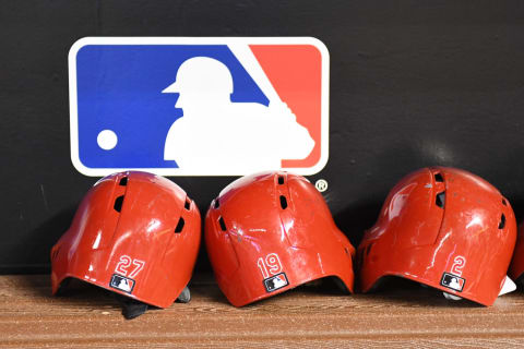 MIAMI, FL – SEPTEMBER 21: A detailed view of the batting helmets of Phillip Ervin #27 and Joey Votto #19 of the Cincinnati Reds in the dugout before the start of the game against the Miami Marlins at Marlins Park on September 21, 2018 in Miami, Florida. (Photo by Eric Espada/Getty Images)