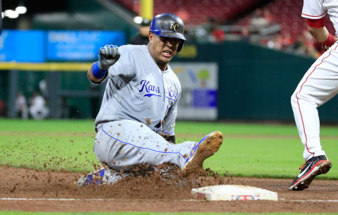 CINCINNATI, OH – SEPTEMBER 25: Salvador Perez #13 of the Kansas City Royals slides into third base against the Cincinnati Reds. (Photo by Andy Lyons/Getty Images)