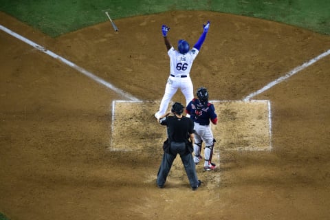 LOS ANGELES, CA – OCTOBER 27: Yasiel Puig #66 of the Los Angeles Dodgers hits a three-run home run in the sixth inning of Game Four of the 2018 World Series against pitcher Eduardo Rodriguez #57 of the Boston Red Sox (not in photo) at Dodger Stadium on October 27, 2018 in Los Angeles, California. (Photo by Harry How/Getty Images)