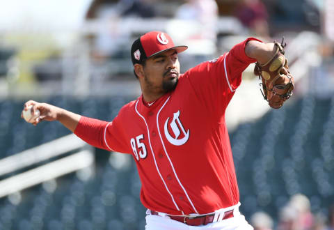 GOODYEAR, ARIZONA – MARCH 04: Tony Santillan #85 of the Cincinnati Reds delivers a first inning pitch against the Chicago Cubs during a spring training game at Goodyear Ballpark on March 04, 2019 in Goodyear, Arizona. (Photo by Norm Hall/Getty Images)