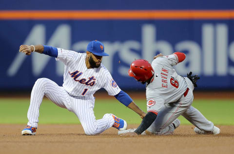 NEW YORK, NEW YORK – APRIL 30: Amed Rosario #1 of the New York Mets picks off Phillip Ervin #6 of the Cincinnati Reds as he tries to steal in the second inning at Citi Field on April 30, 2019 in Flushing neighborhood of the Queens borough of New York City. (Photo by Elsa/Getty Images)