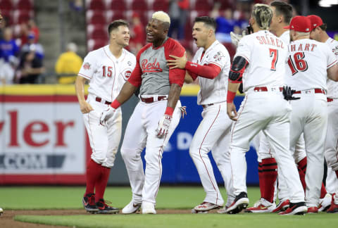 CINCINNATI, OHIO – MAY 15: Yasiel Puig #66 of the Cincinnati Reds celebrates with teammates after hitting a game winning single in the 10th inning against the Chicago Cubs at Great American Ball Park on May 15, 2019 in Cincinnati, Ohio. (Photo by Andy Lyons/Getty Images)
