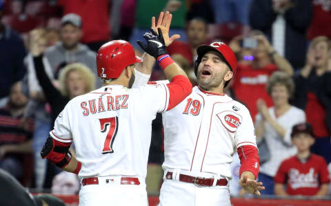 CINCINNATI, OHIO – MAY 15: Joey Votto #19 and Eugenio Suarez #7 of the Cincinnati Reds celebrate after Suarez hit a game tying two run home run in the 8th inning against Chicago Cubs at Great American Ball Park on May 15, 2019 in Cincinnati, Ohio. (Photo by Andy Lyons/Getty Images)