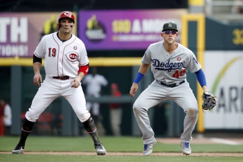 CINCINNATI, OH – MAY 18: Matt Beaty #45 of the Los Angeles Dodgers plays defense at first base alongside Joey Votto #19 of the Cincinnati Reds. (Photo by Joe Robbins/Getty Images)