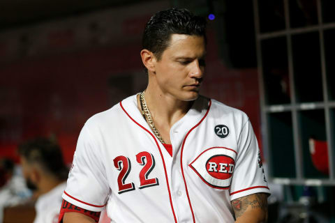 CINCINNATI, OH – JULY 18: Derek Dietrich #22 of the Cincinnati Reds stands in the dugout. (Photo by Kirk Irwin/Getty Images)