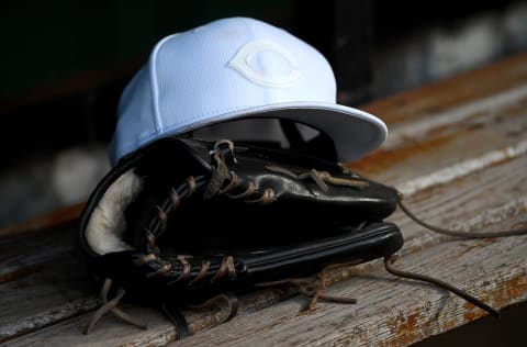 PITTSBURGH, PA – AUGUST 23: A detailed view of a Cincinnati Reds cap and a glove in the dugout. (Photo by Justin Berl/Getty Images)