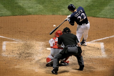 MILWAUKEE, WISCONSIN – JULY 23: Christian Yelich #22 of the Milwaukee Brewers hits a single in the fifth inning against the Cincinnati Reds (Photo by Dylan Buell/Getty Images)