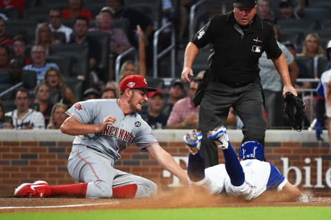 ATLANTA, GEORGIA – AUGUST 03: Ozzie Albies #1 of the Atlanta Braves slides safely into home in the 5th inning against the Cincinnati Reds. (Photo by Logan Riely/Getty Images)