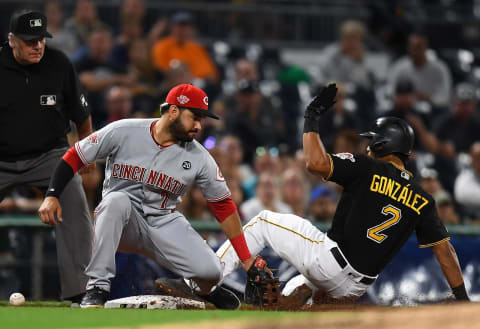 PITTSBURGH, PA – SEPTEMBER 27: Erik Gonzalez #2 of the Pittsburgh Pirates slides safely into third base in front of Eugenio Suarez #7 of the Cincinnati Reds (Photo by Joe Sargent/Getty Images)
