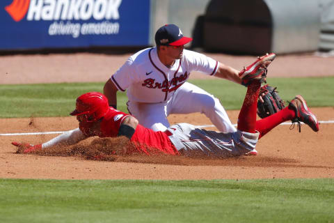 ATLANTA, GA – SEPTEMBER 30: Nick Castellanos #2 of the Cincinnati Reds is out at third with the tag of Austin Riley. (Photo by Todd Kirkland/Getty Images)