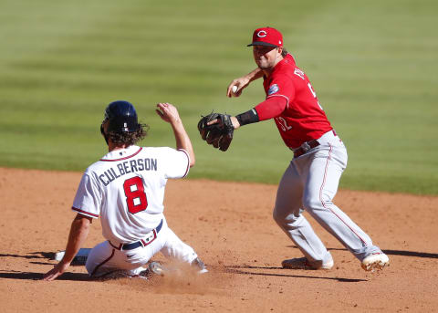 ATLANTA, GA – SEPTEMBER 30: Charlie Culberson #8 of the Atlanta Braves is forced out at second by Kyle Farmer #52 of the Cincinnati Reds. (Photo by Todd Kirkland/Getty Images)