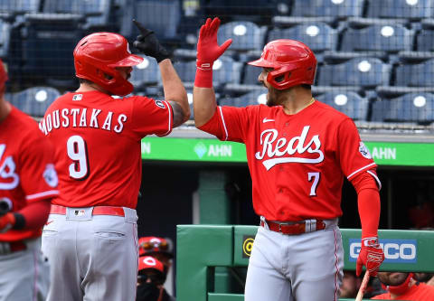 PITTSBURGH, PA – MAY 12: Mike Moustakas #9 of the Cincinnati Reds celebrates his solo home run with Eugenio Suarez #7 during the second inning. (Photo by Joe Sargent/Getty Images)