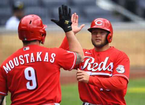 PITTSBURGH, PA – MAY 12: Nick Senzel #15 of the Cincinnati Reds celebrate with Mike Moustakas #9 after scoring. (Photo by Joe Sargent/Getty Images)