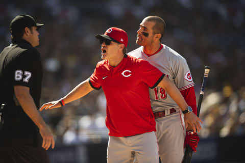 SAN DIEGO, CA – JUNE 19: Joey Votto #19 is held back by manager David Bell #25 of the Cincinnati Reds after being ejected. (Photo by Matt Thomas/San Diego Padres/Getty Images)