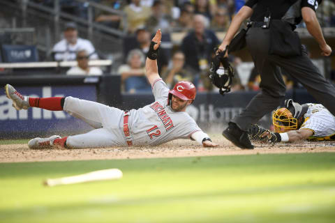 SAN DIEGO, CA – JUNE 19: Tyler Naquin #12 of the Cincinnati Reds scores ahead of the tag. (Photo by Denis Poroy/Getty Images)