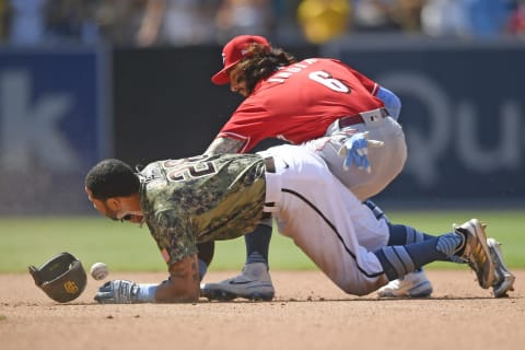 SAN DIEGO, CA – JUNE 20: Tommy Pham #28 of the San Diego Padres slides into second base with a double ahead of the throw to Jonathan India #6 of the Cincinnati Reds. (Photo by Denis Poroy/Getty Images)