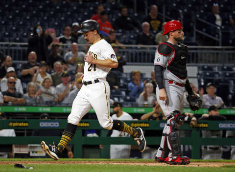 PITTSBURGH, PA – SEPTEMBER 15: Bryan Reynolds #10 of the Pittsburgh Pirates scores on a sacrifice fly in the third inning against the Cincinnati Reds. (Photo by Justin K. Aller/Getty Images)