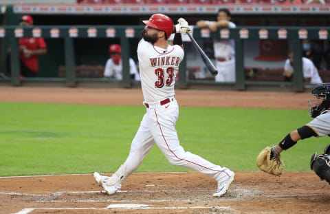 CINCINNATI, OHIO – AUGUST 14: Jesse Winker #33 of the Cincinnati Reds hits a home run (Photo by Andy Lyons/Getty Images)