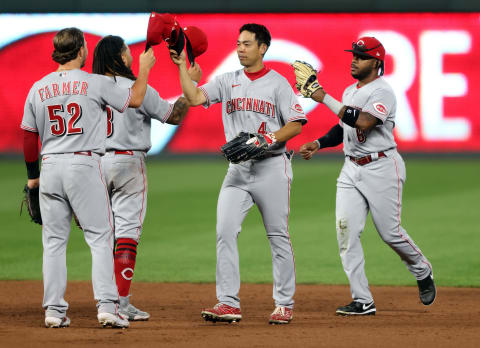 KANSAS CITY, MISSOURI – AUGUST 19: Shogo Akiyama #4 of the Cincinnati Reds congratulates teammates after the Reds defeated the Kansas City Royals. (Photo by Jamie Squire/Getty Images)