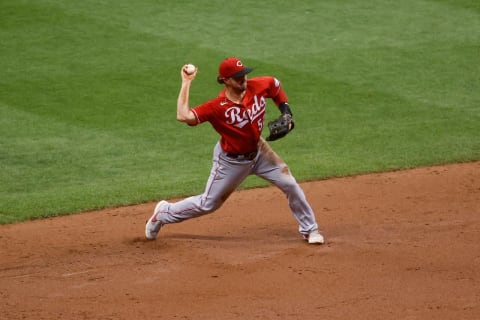 MILWAUKEE, WISCONSIN – AUGUST 24: Kyle Farmer #52 of the Cincinnati Reds throws to first base in the third inning. (Photo by Dylan Buell/Getty Images)