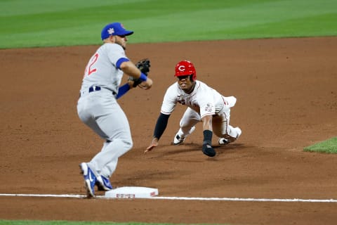 CINCINNATI, OH – AUGUST 29: Jose Garcia #42 of the Cincinnati Reds attempts to beat the throw to David Bote #42 of the Chicago Cubs. (Photo by Kirk Irwin/Getty Images)