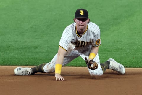 ARLINGTON, TEXAS – OCTOBER 08: Jake Cronenworth #9 of the San Diego Padres fields a ball during the fifth inning. (Photo by Tom Pennington/Getty Images)