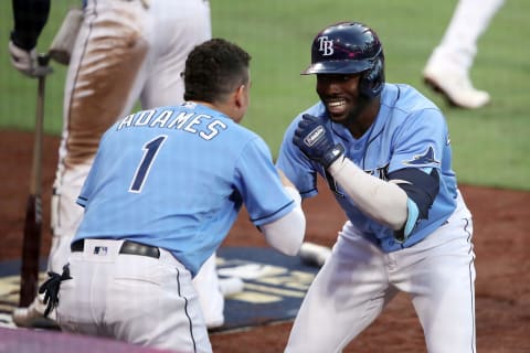 SAN DIEGO, CALIFORNIA – OCTOBER 11: Randy Arozarena #56 of the Tampa Bay Rays is congratulated by Willy Adames #1 after hitting a solo home run. (Photo by Sean M. Haffey/Getty Images)