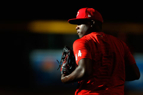 PHOENIX, ARIZONA – APRIL 09: Aristides Aquino #44 of the Cincinnati Reds warms up. (Photo by Christian Petersen/Getty Images)