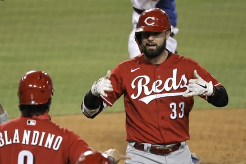 LOS ANGELES, CALIFORNIA – APRIL 26: Jesse Winker #33 of the Cincinnati Reds celebrates with Alex Blandino. (Photo by Michael Owens/Getty Images)