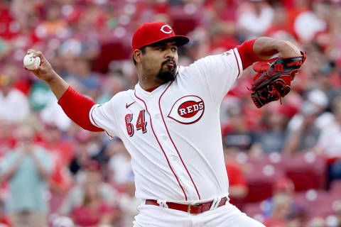 CINCINNATI, OHIO – JUNE 24: Tony Santillan #64 of the Cincinnati Reds pitches in the first inning against the Atlanta Brave. (Photo by Dylan Buell/Getty Images)