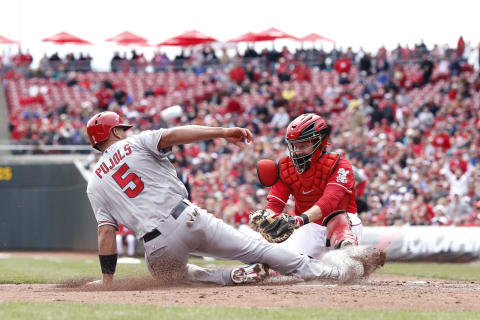 CINCINNATI, OH – APRIL 4: Albert Pujols #5 of the Los Angeles Angels of Anaheim slides into home ahead of the tag by Ryan Hanigan #29 of the Cincinnati Reds during the third inning. (Photo by Joe Robbins/Getty Images)