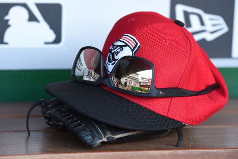 WASHINGTON, DC – JULY 01: Cincinnati Reds cap and glove in the dug out before a baseball game against the Cincinnati Reds at Nationals Park on July 1, 2016 in Washington,DC. (Photo by Mitchell Layton/Getty Images)