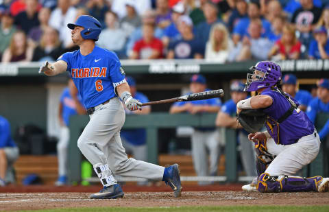 OMAHA, NE – JUNE 26: Third basemen Jonathan India #6 of the Florida Gators hits a two run double against the LSU Tigers in the third inning during game one of the College World Series Championship Series on June 26, 2017 at TD Ameritrade Park in Omaha, Nebraska. (Photo by Peter Aiken/Getty Images)