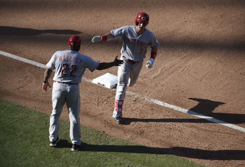 SAN DIEGO, CA – JUNE 3: Scooter Gennett #3 of the Cincinnati Reds is congratulated by Billy Hatcher #22 of the Cincinnati Reds after hitting a solo home run during the eighth inning of a baseball game at PETCO Park on June 3, 2018 in San Diego, California. (Photo by Denis Poroy/Getty Images)