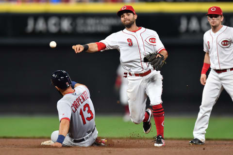 CINCINNATI, OH – JUNE 8: Jose Peraza #9 of the Cincinnati Reds throws to first base after forcing out Matt Carpenter #13 of the St. Louis Cardinals at second base in the seventh inning at Great American Ball Park on June 8, 2018 in Cincinnati, Ohio. (Photo by Jamie Sabau/Getty Images)