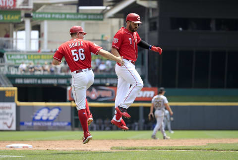 CINCINNATI, OHIO – JULY 31: Eugenio Suarez #7 of the Cincinnati Reds celebrates with third base coach J.R. House after hitting a home run. (Photo by Andy Lyons/Getty Images)