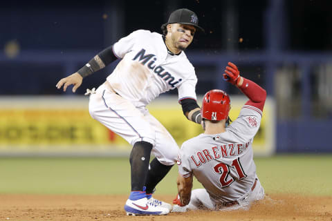 MIAMI, FLORIDA – AUGUST 29: Isan Diaz #1 of the Miami Marlins tags out Michael Lorenzen #21 of the Cincinnati Reds. (Photo by Michael Reaves/Getty Images)