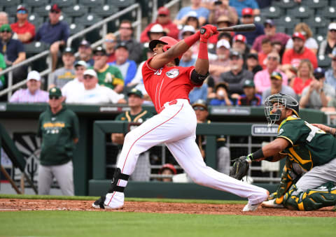 GOODYEAR, ARIZONA – FEBRUARY 28: Jose Garcia #83 of the Cincinnati Reds follows through on a swing. (Photo by Norm Hall/Getty Images)