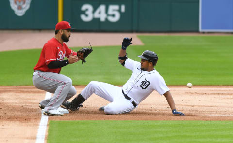 DETROIT, MI – AUGUST 02: Jeimer Candelario #46 of the Detroit Tigers slides safely into third base while Eugenio Suarez #7 of the Cincinnati Reds waits for the throw. (Photo by Mark Cunningham/MLB Photos via Getty Images)