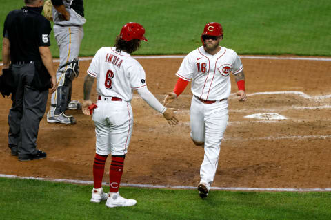 CINCINNATI, OH – APRIL 06: Jonathan India #6 of the Cincinnati Reds congratulates Tucker Barnhart #16 after they both were driven in by Tyler Naquin #12 during the fifth inning of the game. (Photo by Kirk Irwin/Getty Images)