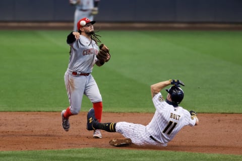 MILWAUKEE, WISCONSIN – AUGUST 08: Freddy Galvis #3 of the Cincinnati Reds turns a double play. (Photo by Dylan Buell/Getty Images)