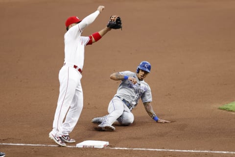 CINCINNATI, OH – AUGUST 12: Adalberto Mondesi #27 of the Kansas City Royals slides at third base under the throw to Eugenio Suarez #7 of the Cincinnati Reds. (Photo by Joe Robbins/Getty Images)