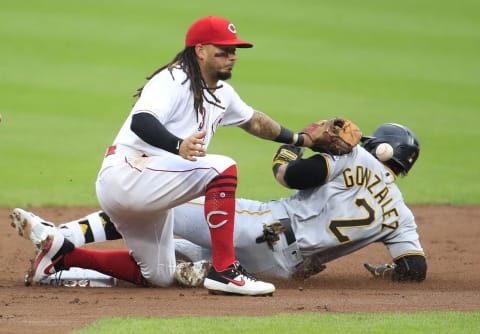 CINCINNATI, OHIO – AUGUST 14: Erik Gonzalez #2 of the Pittsburgh Pirates slides safely into second base for a double ahead of the tag by Freddy Galvis #3 of the Cincinnati Reds. (Photo by Andy Lyons/Getty Images)