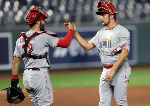 KANSAS CITY, MISSOURI – AUGUST 19: Starting pitcher Trevor Bauer #27 of the Cincinnati Reds is congratulated by catcher Curt Casali #12 after the Reds defeated the Kansas City Royals 5-0. (Photo by Jamie Squire/Getty Images)