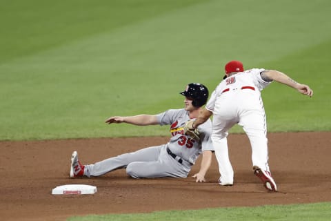 CINCINNATI, OH – AUGUST 31: Lane Thomas #35 of the St Louis Cardinals gets tagged out on a force play at second base by Mike Moustakas #9 of the Cincinnati Reds. (Photo by Joe Robbins/Getty Images)