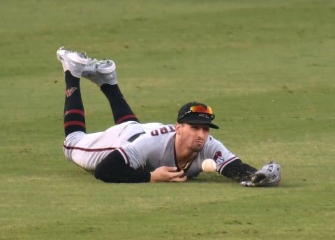 LOS ANGELES, CALIFORNIA – SEPTEMBER 01: Tim Locastro #16 of the Arizona Diamondbacks misses a catch. (Photo by Harry How/Getty Images)