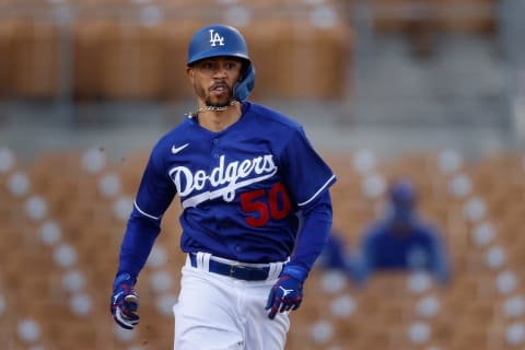 GLENDALE, ARIZONA – MARCH 10: Mookie Betts #50 of the Los Angeles Dodgers runs to first base on a ground ball. (Photo by Christian Petersen/Getty Images)