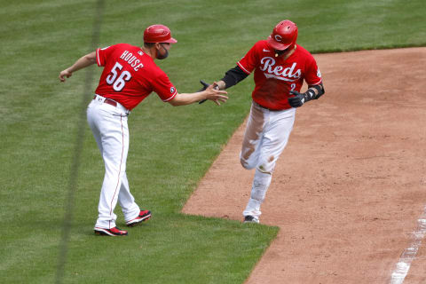 CINCINNATI, OH – APRIL 07: Nick Castellanos #2 of the Cincinnati Reds is congratulated by third base coach J.R. House #56 after hitting a home run. (Photo by Kirk Irwin/Getty Images)