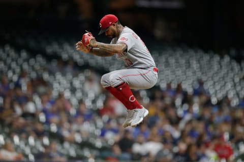 MILWAUKEE, WISCONSIN – JUNE 14: Vladimir Gutierrez #53 of the Cincinnati Reds jumps into the air to stretch. (Photo by John Fisher/Getty Images)