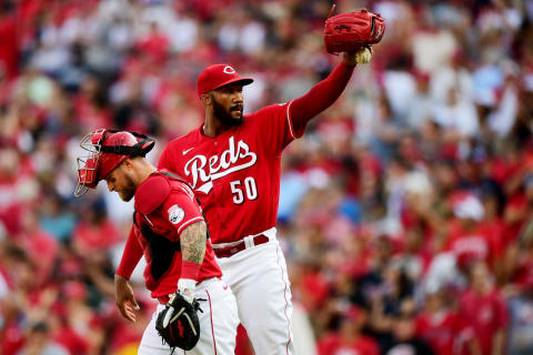 CINCINNATI, OHIO – JUNE 26: Amir Garrett #50 and Tucker Barnhart #16 of the Cincinnati Reds react to their 4-1 win. (Photo by Emilee Chinn/Getty Images)